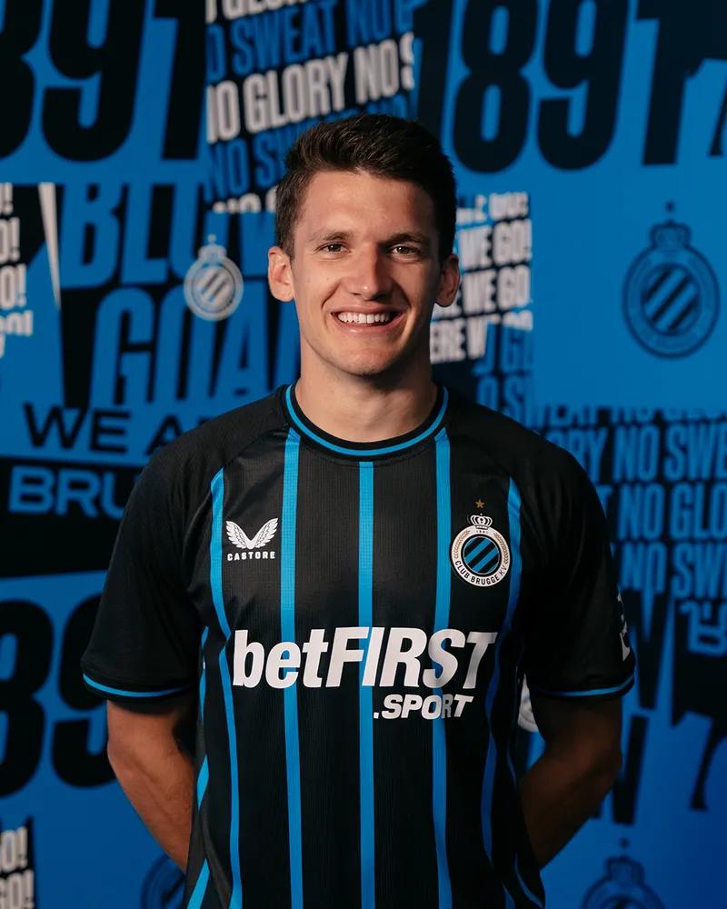 Christos Tzolis wearing a Club Brugge shirt