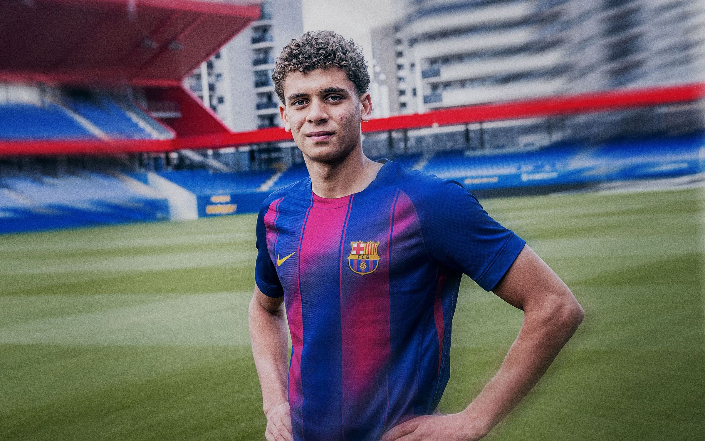 Hamza Abdelkarim wearing a Barcelona shirt at the club facilities