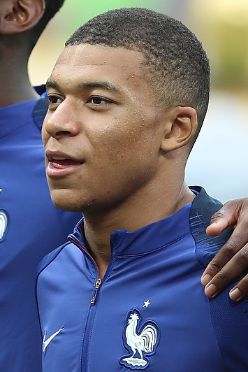 Kylian Mbappe wearing a France national team jacket